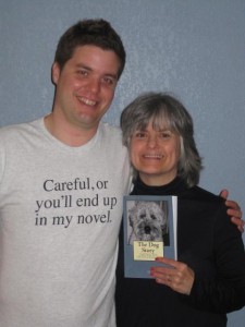 Matt Cavallo wearing his careful or you'll end up in my novel shirt posing with his mom, who got him the shirt because she ended up in the story.