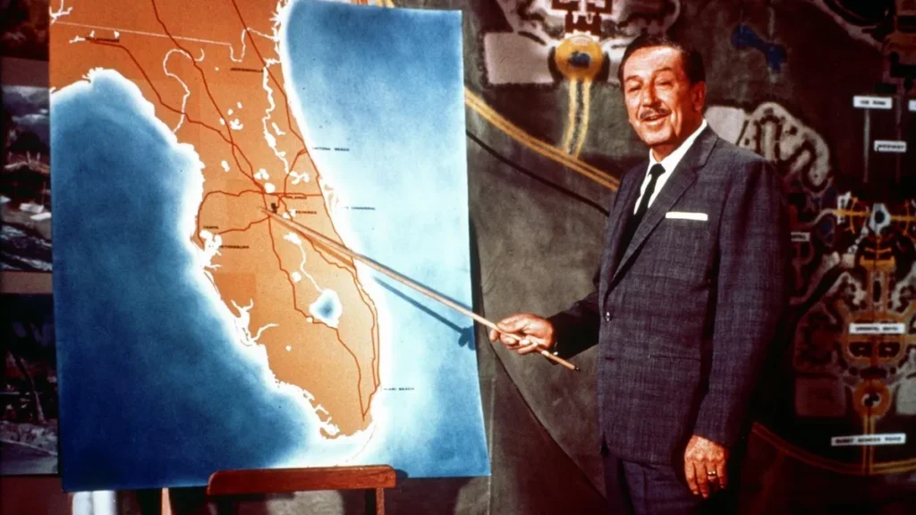 Walt Disney pointing at a map of Florida.