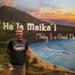 Matt Cavallo standing in front of a painting of Hawaii