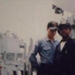 Matt Cavallo and Anthony Lowe on the deck of the USS Cole.