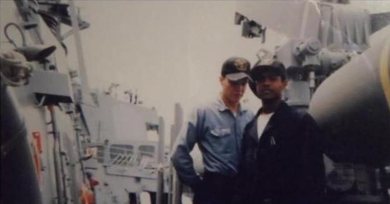 Matt Cavallo and Anthony Lowe on the deck of the USS Cole.
